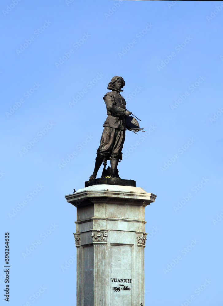 Statue of the Spanish painter Velazquez in Seville, isolated over the blue sky