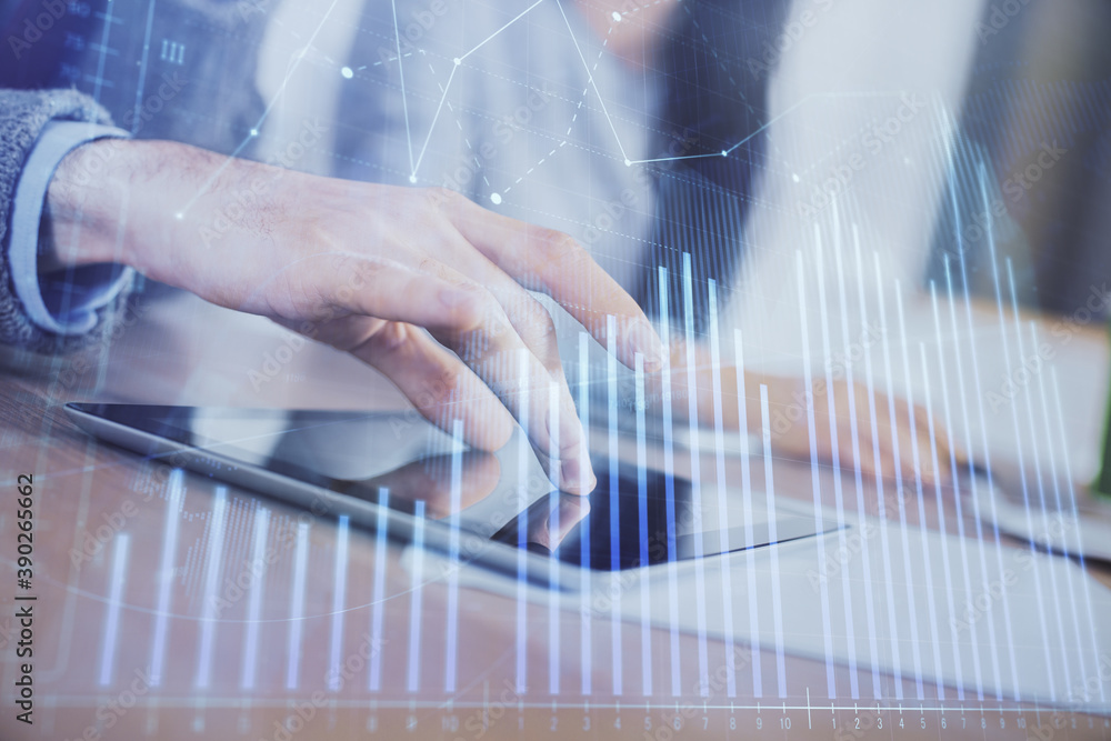Double exposure of forex graph drawing and man and woman working together holding and using a mobile device. Trade concept. Double exposure of forex graph drawing and man and woman working together holding and using a mobile device. Trade concept.