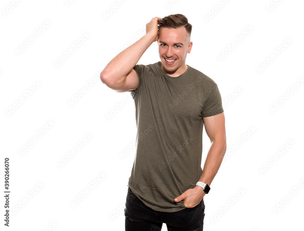 Candid shot of handsome young and fit man posing on isolated background Candid shot of handsome young and fit man posing on isolated background