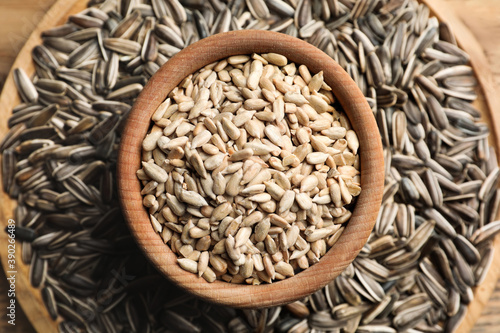 Raw sunflower seeds on table, top view