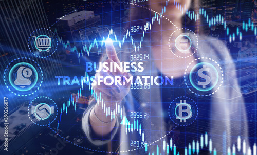 Business, Technology, Internet and network concept. Young businessman working on a virtual screen of the future and sees the inscription: Business transformation