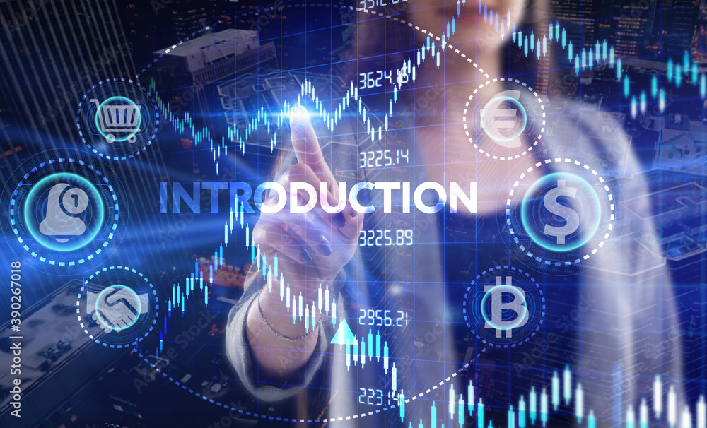 Business, Technology, Internet and network concept. Young businessman working on a virtual screen of the future and sees the inscription: Introduction Business, Technology, Internet and network concept. Young businessman working on a virtual screen of the future and sees the inscription: Introduction