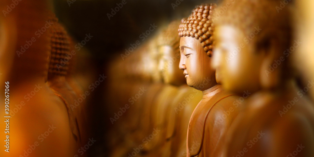 close up of wooden statue of buddha, in buddhist temple close up of wooden statue of buddha, in buddhist temple