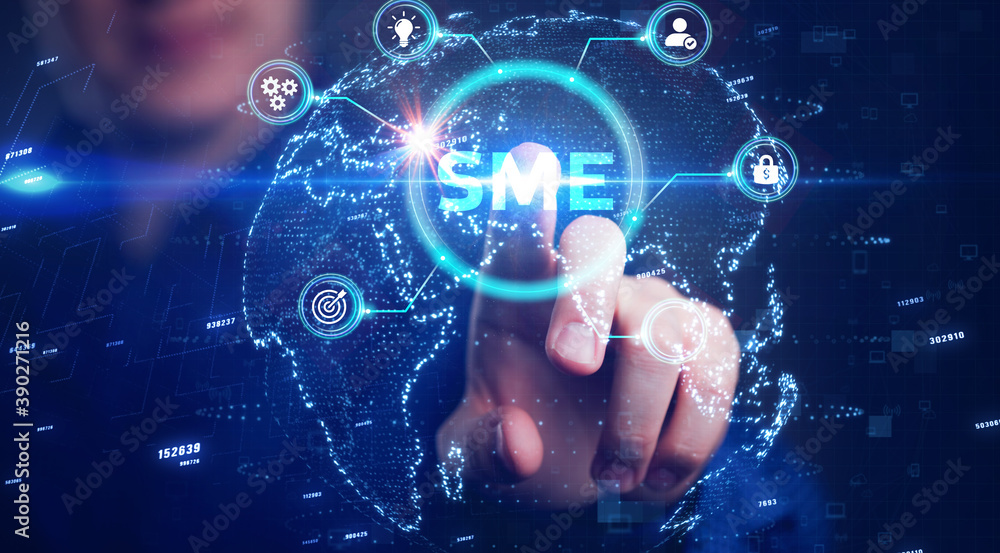 The concept of business, technology, the Internet and the network. A young entrepreneur working on a virtual screen of the future and sees the inscription: SME The concept of business, technology, the Internet and the network. A young entrepreneur working on a virtual screen of the future and sees the inscription: SME