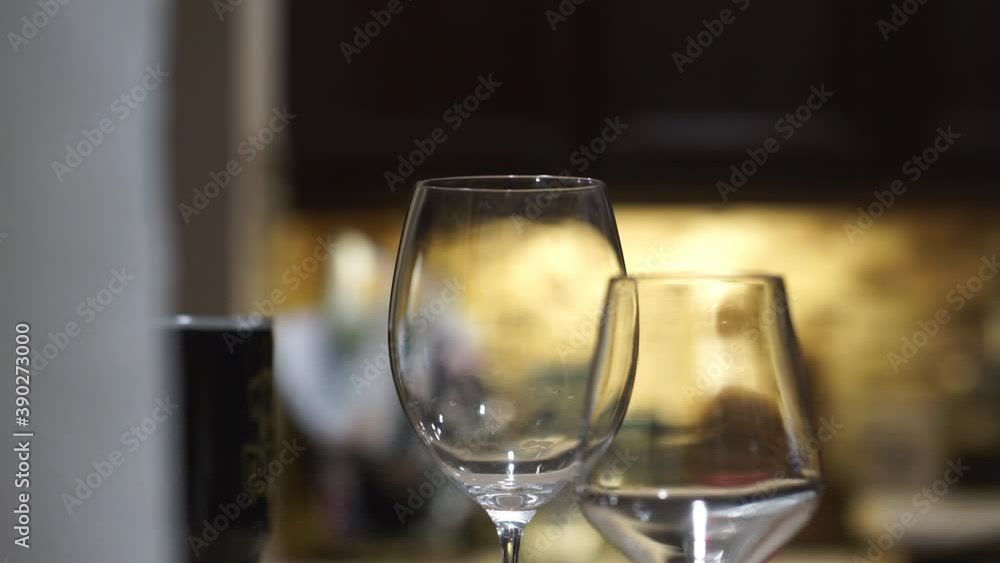 Decanter pours wine in wine glasses Decanter pours wine in wine glasses