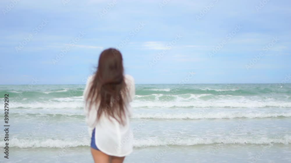 Happy Excited Young Asian Woman Running on Beach and Raising Hands, Slow Motion Full Frame Happy Excited Young Asian Woman Running on Beach and Raising Hands, Slow Motion Full Frame