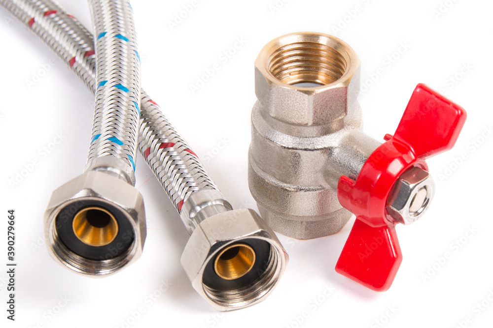 Plumbing gate ball vales, flexible water hose and fittings on a white background Plumbing gate ball vales, flexible water hose and fittings on a white background