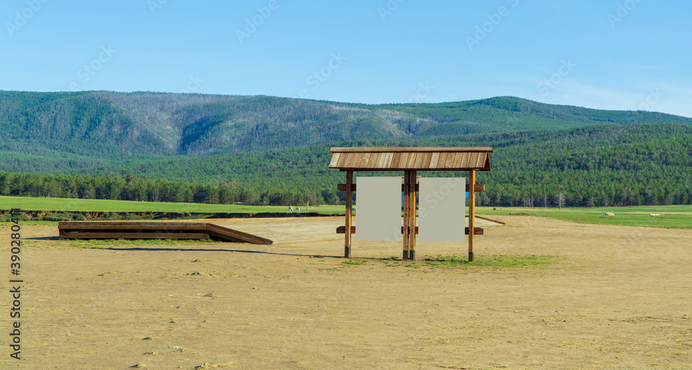 advertising banners on the nature. information stand in the middle of the steppe on the background of hills