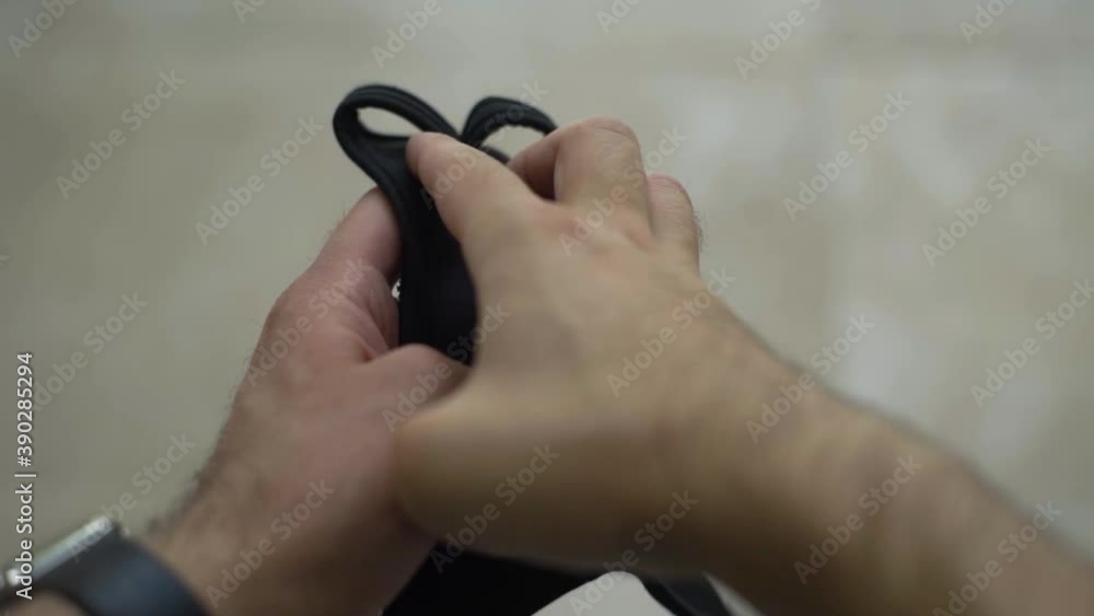 Detail shot of young man getting ready to work out