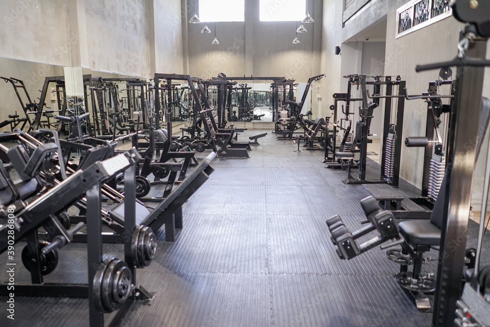 Fototapeta premium Gym with modern fitness equipment for fitness body workout.