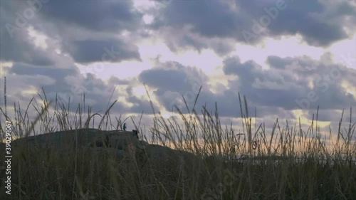 Kids jumping on rocks in sunset, slowmotion 120fps