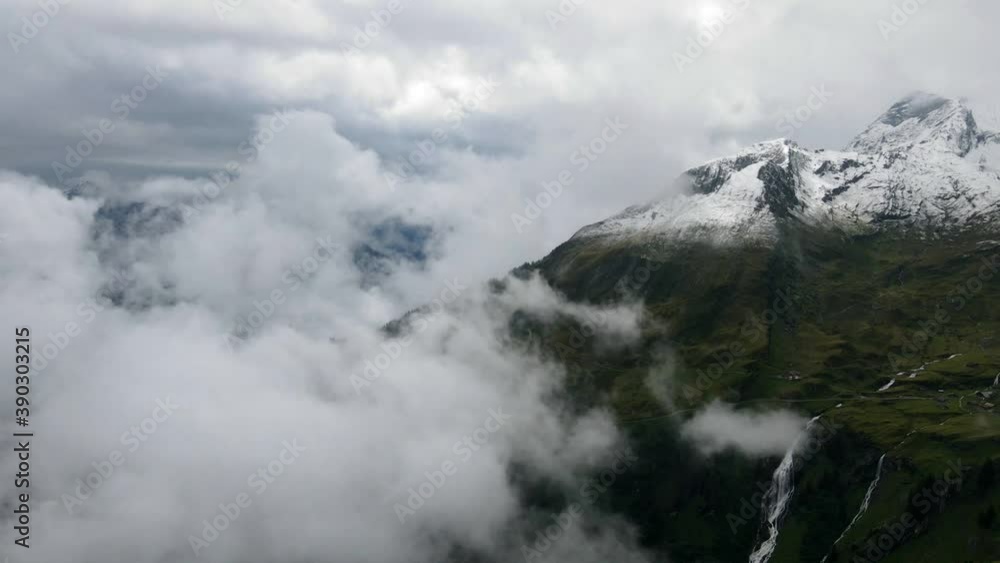 Clouds revealing the waterfall in the mountains. HD Clouds revealing the waterfall in the mountains. HD