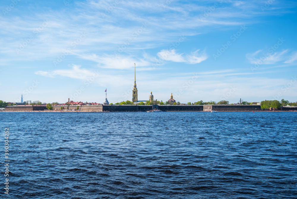 Fototapeta premium Peter and Paul fortress in Saint-Petersburg, Russia. Petersburg architecture. Petersburg museums. Walls of fortress, spring blue sky, landscape, sunny day. Neva River.