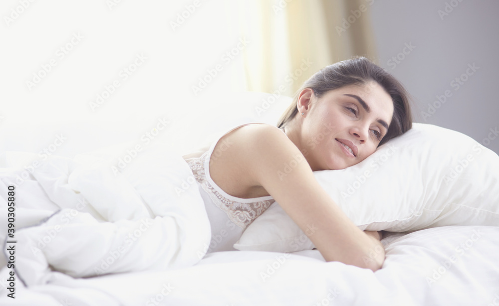 beautiful young woman basking in bed in the morning. Beautiful Model face looks sexy in camera beautiful young woman basking in bed in the morning. Beautiful Model face looks sexy in camera