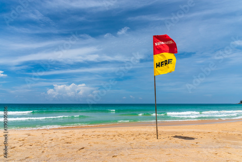 Swim here flag show safty area for swimming at the beach.