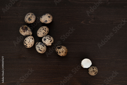 Quail eggs on a dark wooden background. Delicious and healthy Breakfast, lifestyle, ingredients for cooking different dishes. Photo of food.