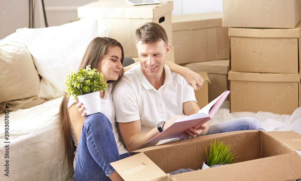 Young Hispanic couple looking at blueprints of new home, high angle view Young Hispanic couple looking at blueprints of new home, high angle view