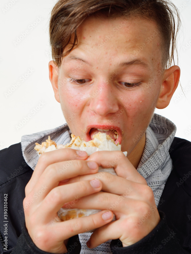 portrait pimply teenager eating fast food shawarma portrait pimply teenager eating fast food shawarma