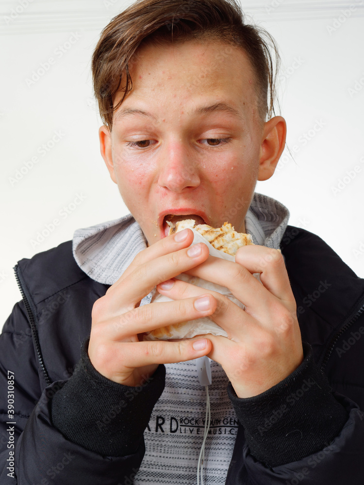 portrait pimply teenager eating fast food shawarma portrait pimply teenager eating fast food shawarma