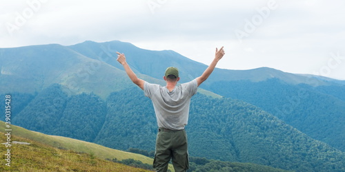 Hiker Man on Hiking Trail. Summer mountains landscape. Travel and journey concept.