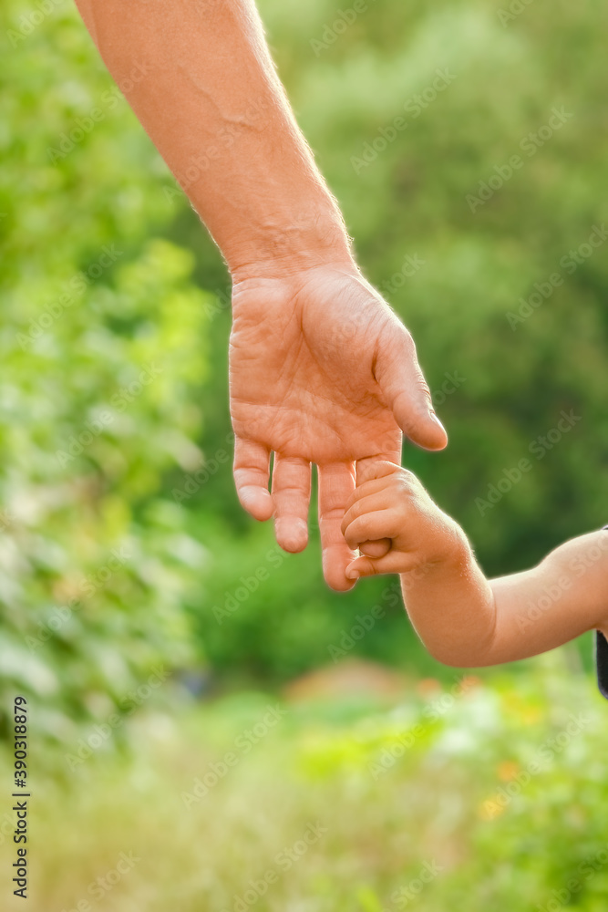 the parent holding the child's hand with a happy background the parent holding the child's hand with a happy background