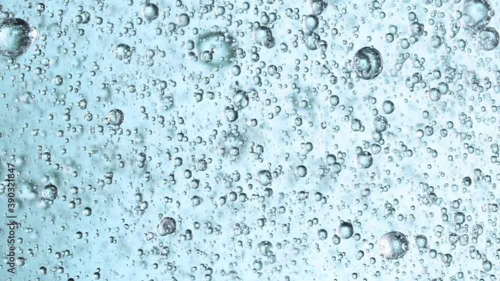 Super Slow Motion Shot of Moving Gel Bubbles in Water on Light Blue Background at 1000fps. Super Slow Motion Shot of Moving Gel Bubbles in Water on Light Blue Background at 1000fps.