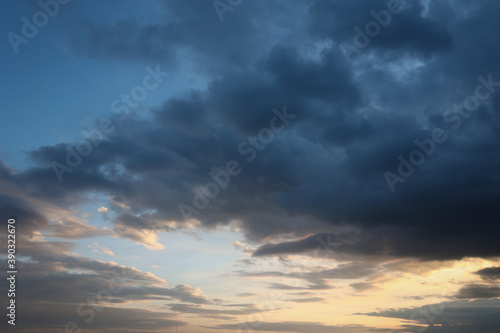 Beautiful sunset sky above clouds with dramatic light