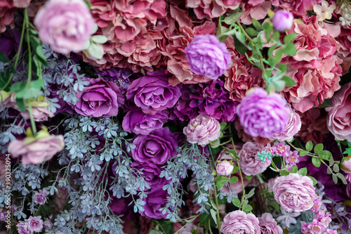 Closeup image of beautiful flowers wall background with amazing colorful roses. Top view