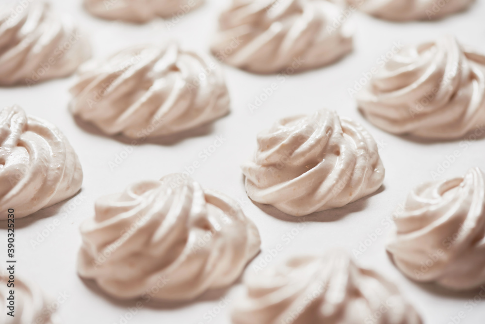 Cooked homemade meringue cookies on baking paper Cooked homemade meringue cookies on baking paper