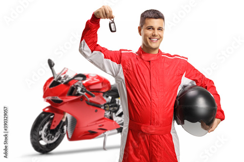 Motorbike racer with a helmet showing a key