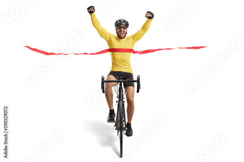 Male cyclist finishing a race and gesturing happiness