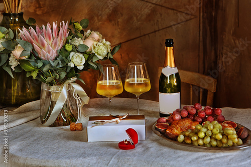 Fototapeta Naklejka Na Ścianę i Meble -  Wedding still life with champagne and a bouquet of flowers