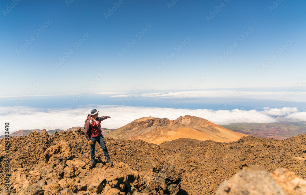 hiker in the top of volcano mountains in teide tenerife canary islands