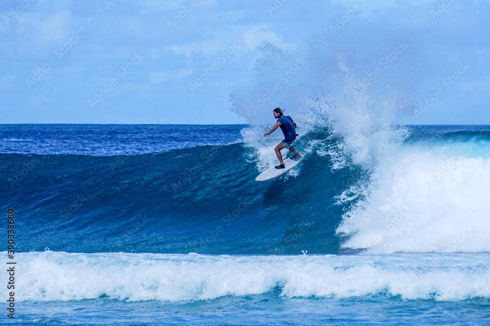 Surfer on perfect blue aquamarine wave, empty line up, perfect for surfing, clean water, Indian Ocean . Surfer on perfect blue aquamarine wave, empty line up, perfect for surfing, clean water, Indian Ocean .
