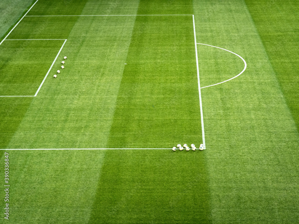 Soccer. Empty football field before the match. Green artificial turf surface and white field lines in a football or soccer playing field. 