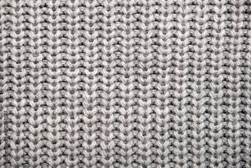 Seamless pattern of knitted warm winter sweater, close-up texture