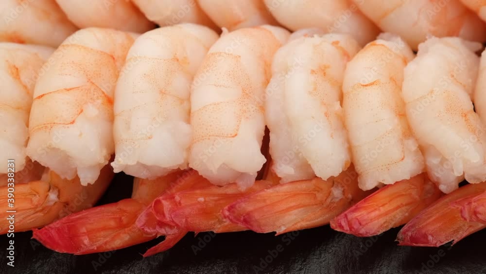 fresh shrimps close up on black plate fresh shrimps close up on black plate