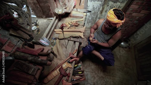 traditional manufacturing of keris handle at Terengganu malaysia with close up shot photo