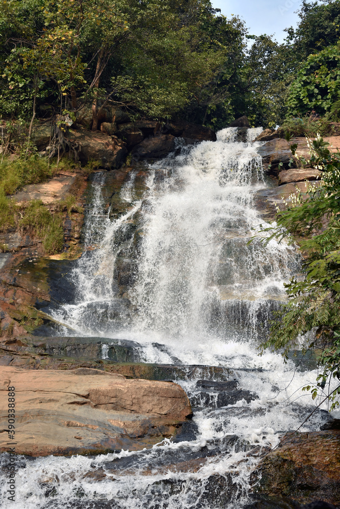 Obraz premium A mountain river is a river that runs usually in mountains, in narrow, deep valley with steep banks, rocky stream bed, and accumulated rock debris.