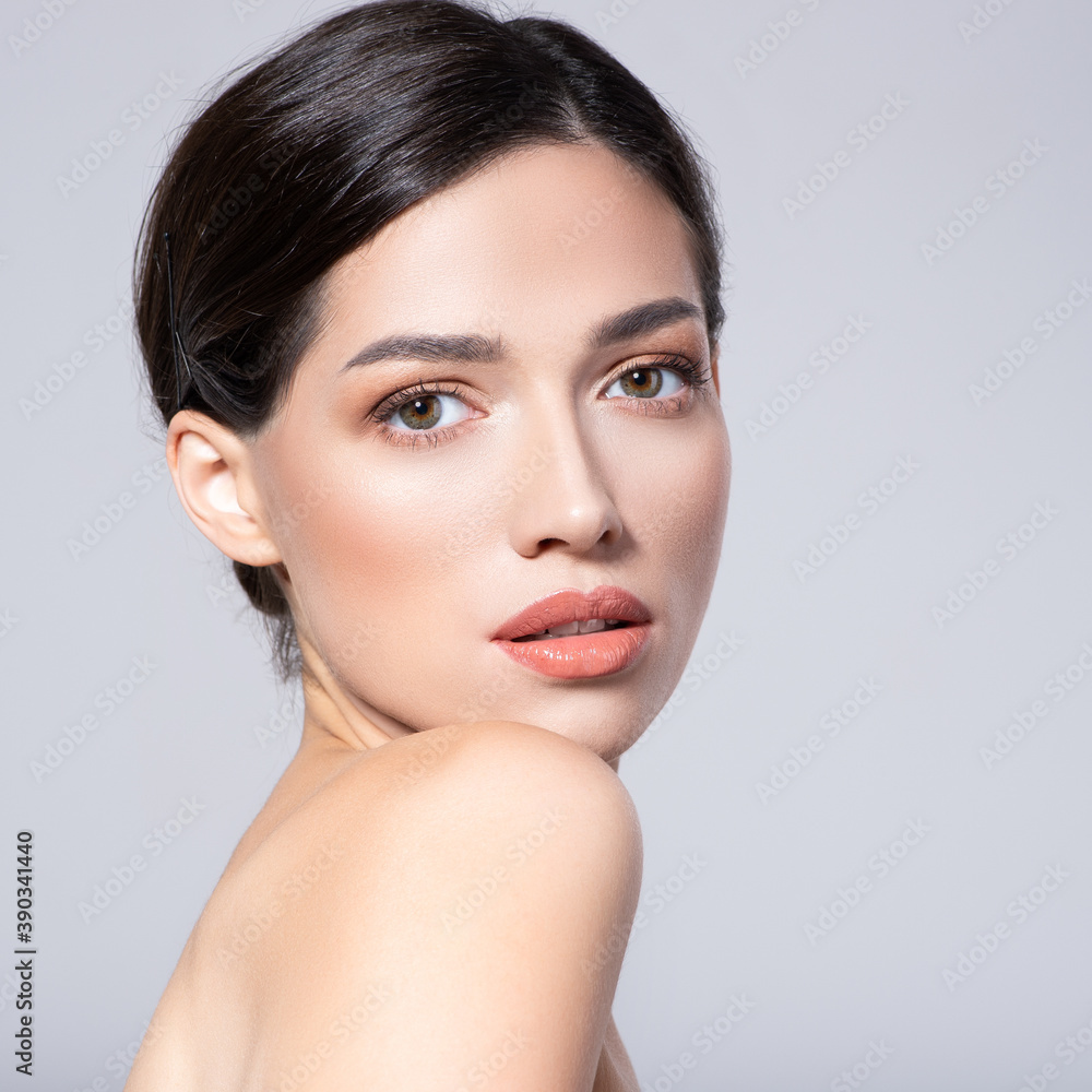 Beautiful face of young woman with health fresh skin. Portrait of beautiful brunette woman with clean face. Beautiful face of young adult woman with clean fresh skin - isolated on white. Skin care. Beautiful face of young woman with health fresh skin. Portrait of beautiful brunette woman with clean face. Beautiful face of young adult woman with clean fresh skin - isolated on white. Skin care.