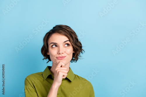 Photo portrait of nice girl having new idea trying to find solution dreaming looking up having a plan isolated on blue color background with copyspace photo