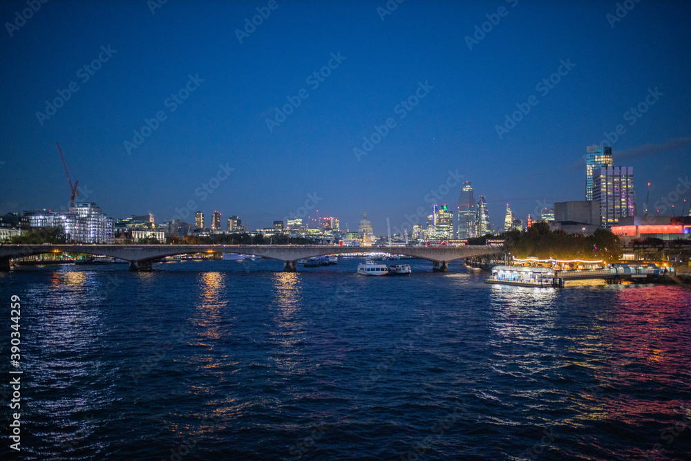 River Thames at night and with the lights of the city reflecting on the water
