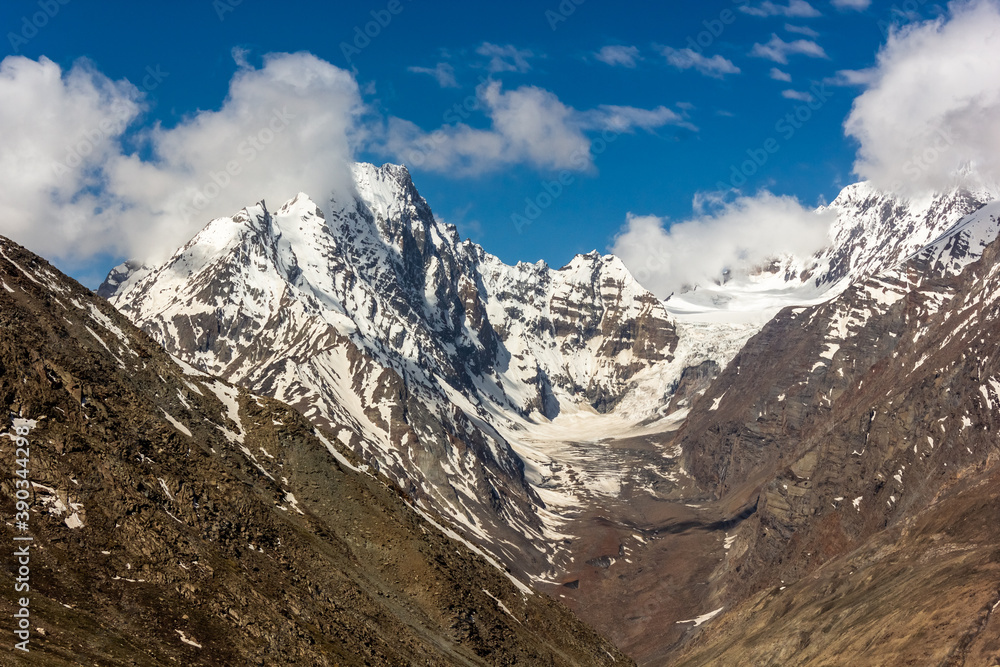 Snow capped mountain peaks and glaciers at the high Himalayan pass of Kunzum La in the Spiti valley.