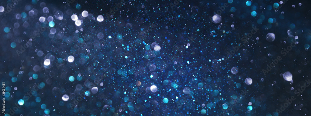 Obraz premium background of abstract glitter lights. silver, blue and black. de focused