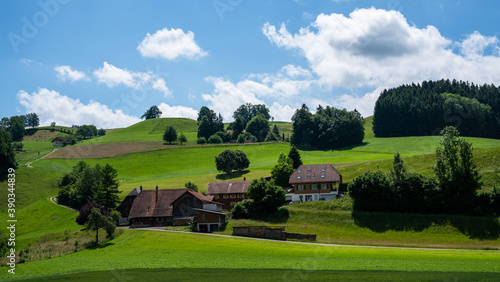 Picturesque view in the beautiful hills. Summer rural view. Colorful summer rural view of farmland. Beautiful outdoor scene near Basel, Switzerland, Europe. Artistic style post processed photo.