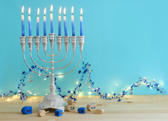 Religion image of jewish holiday Hanukkah background with menorah (traditional candelabra) and candles