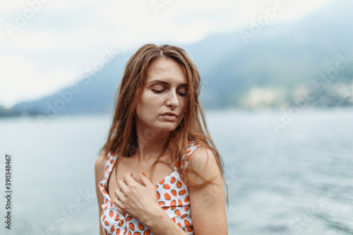 Beautiful girl on the shores of Lake Como