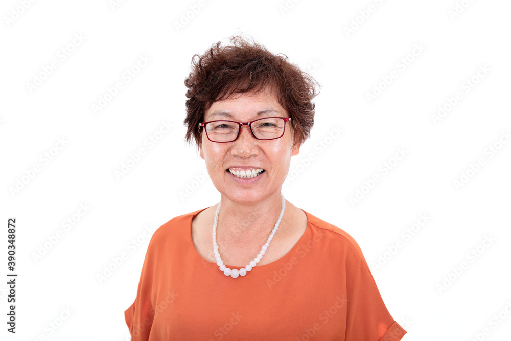 Oriental middle-aged woman smiling in front of white background Oriental middle-aged woman smiling in front of white background