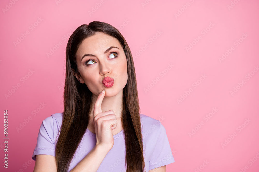 Closeup photo of charming lady long hairdo send boyfriend air kisses look up empty space finger cheek thinking creative idea wear casual purple t-shirt isolated pastel pink color background Closeup photo of charming lady long hairdo send boyfriend air kisses look up empty space finger cheek thinking creative idea wear casual purple t-shirt isolated pastel pink color background