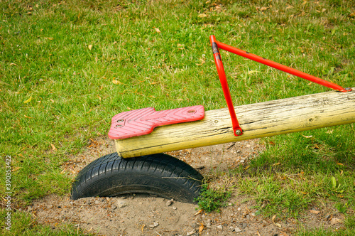 Fotografie POZNAN, POLAND - Jul 18, 2017: Seesaw and Dunlop tire in the ground